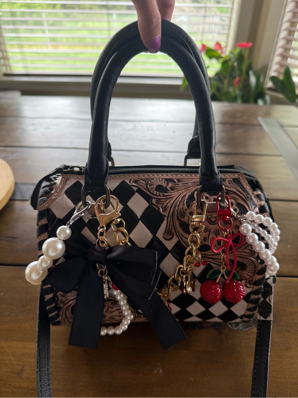 Black and Cream Patterned Crossbody Satchel with Decorative Charms